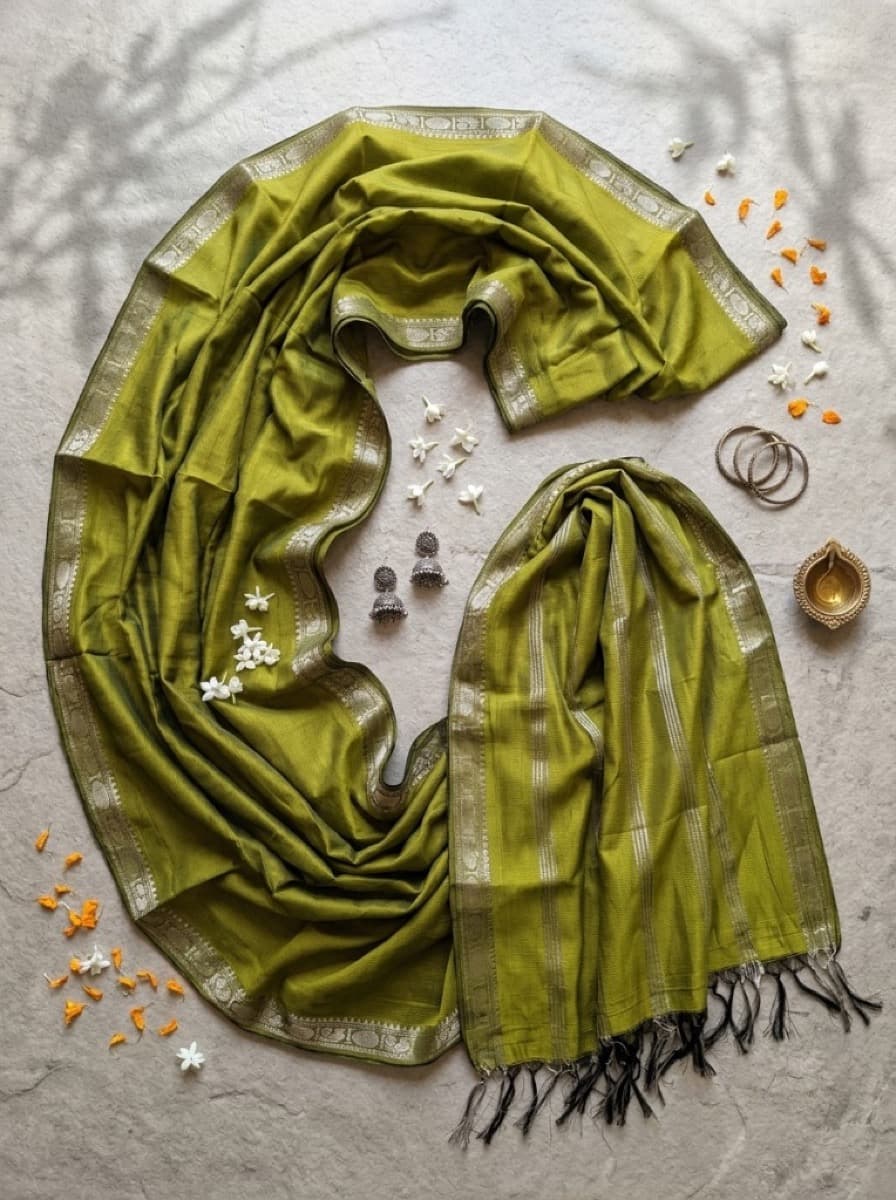 Amara olive Mangalagiri cotton saree flat lay with silver peacock border and black fringe