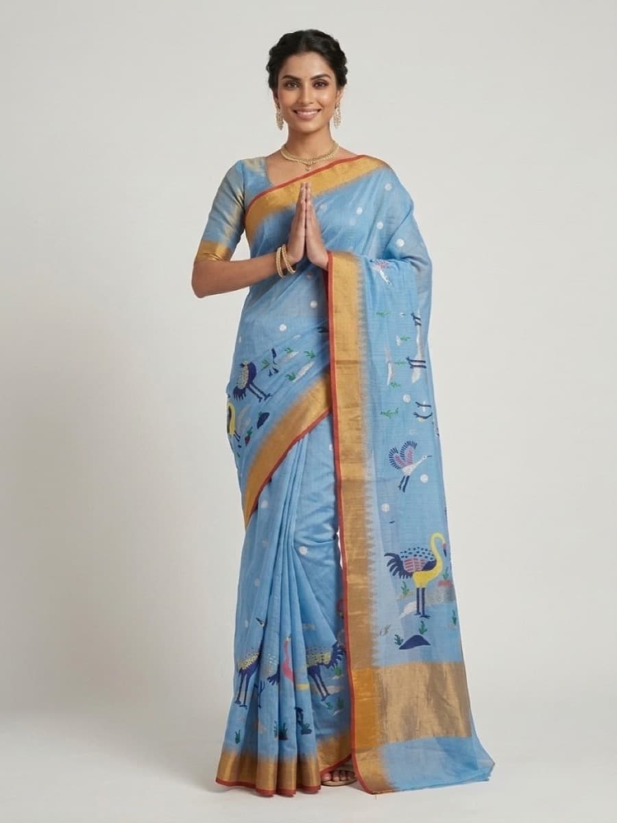 Hansini sky-blue Jamdani saree, namaste pose with silver butis and gold border