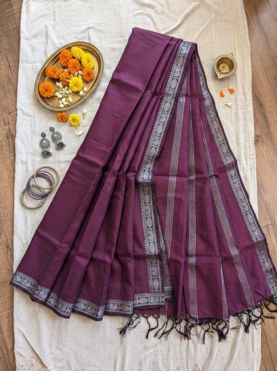 Kadambari plum saree flat lay with silver peacock border