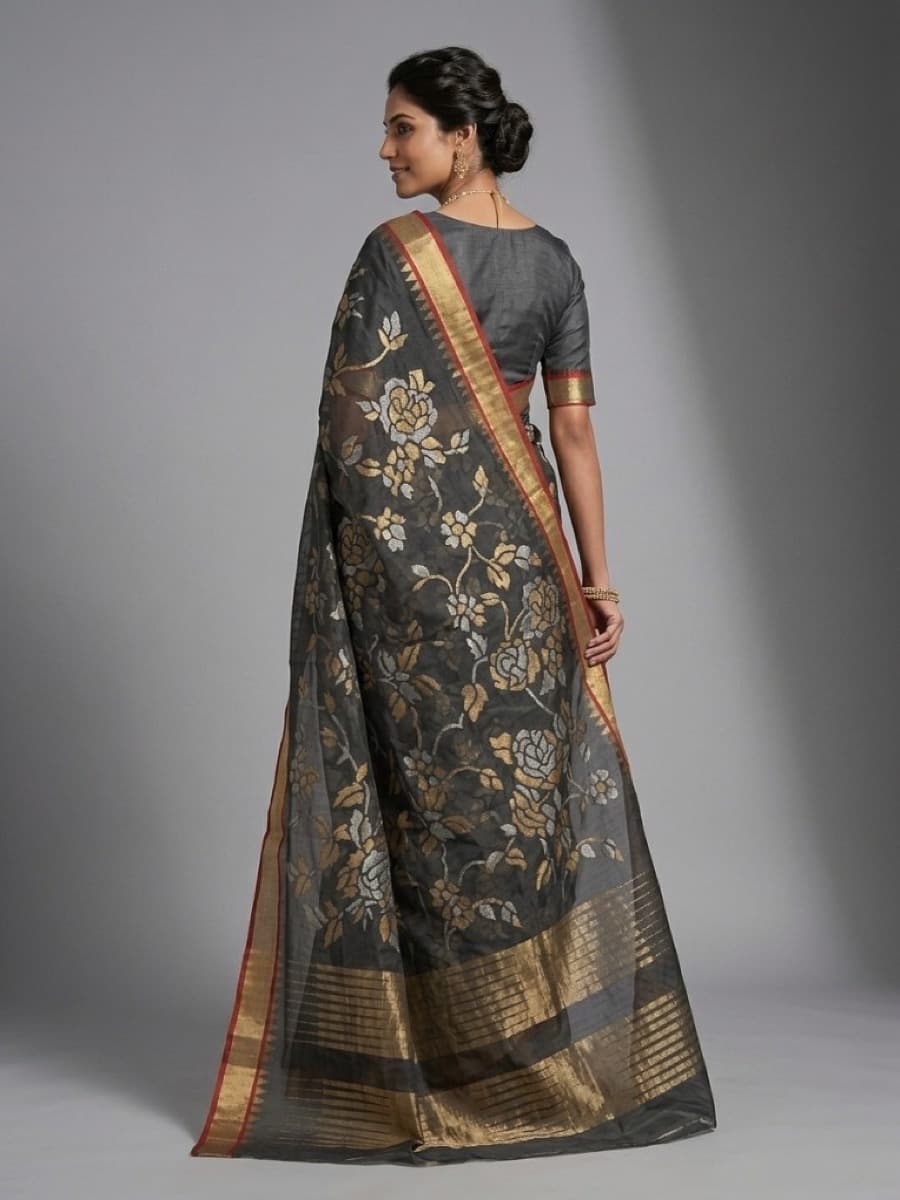 Swarnalata charcoal Jamdani saree from behind in a stone-arched courtyard