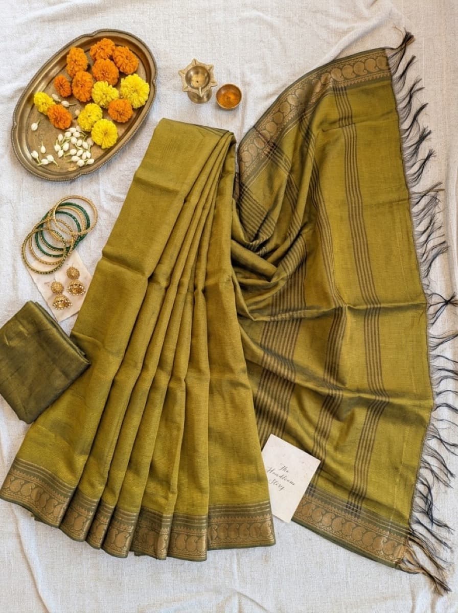 Vanaja mehendi saree flat lay with blouse piece, gold peacock border and striped pallu